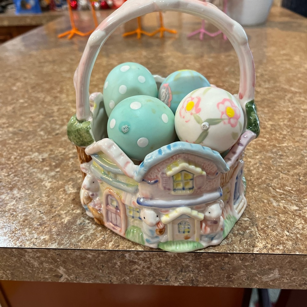 Older Easter basket with 8 decorated eggs. Approx 6” in diameter